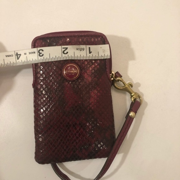 Coach pink python embossed wristlet bag